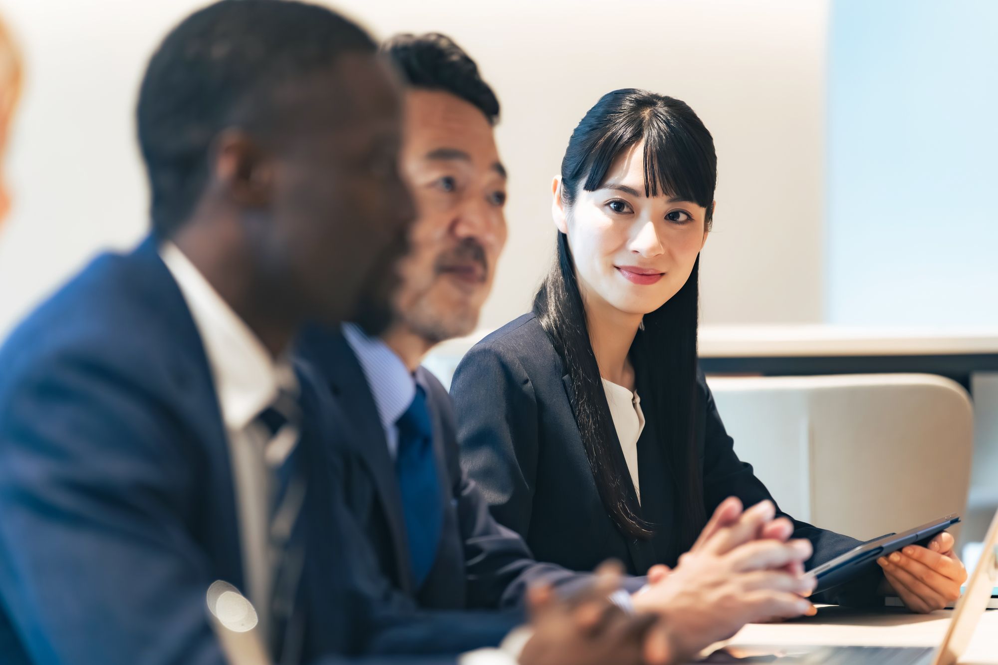 Japanese and international business professionals meeting together
